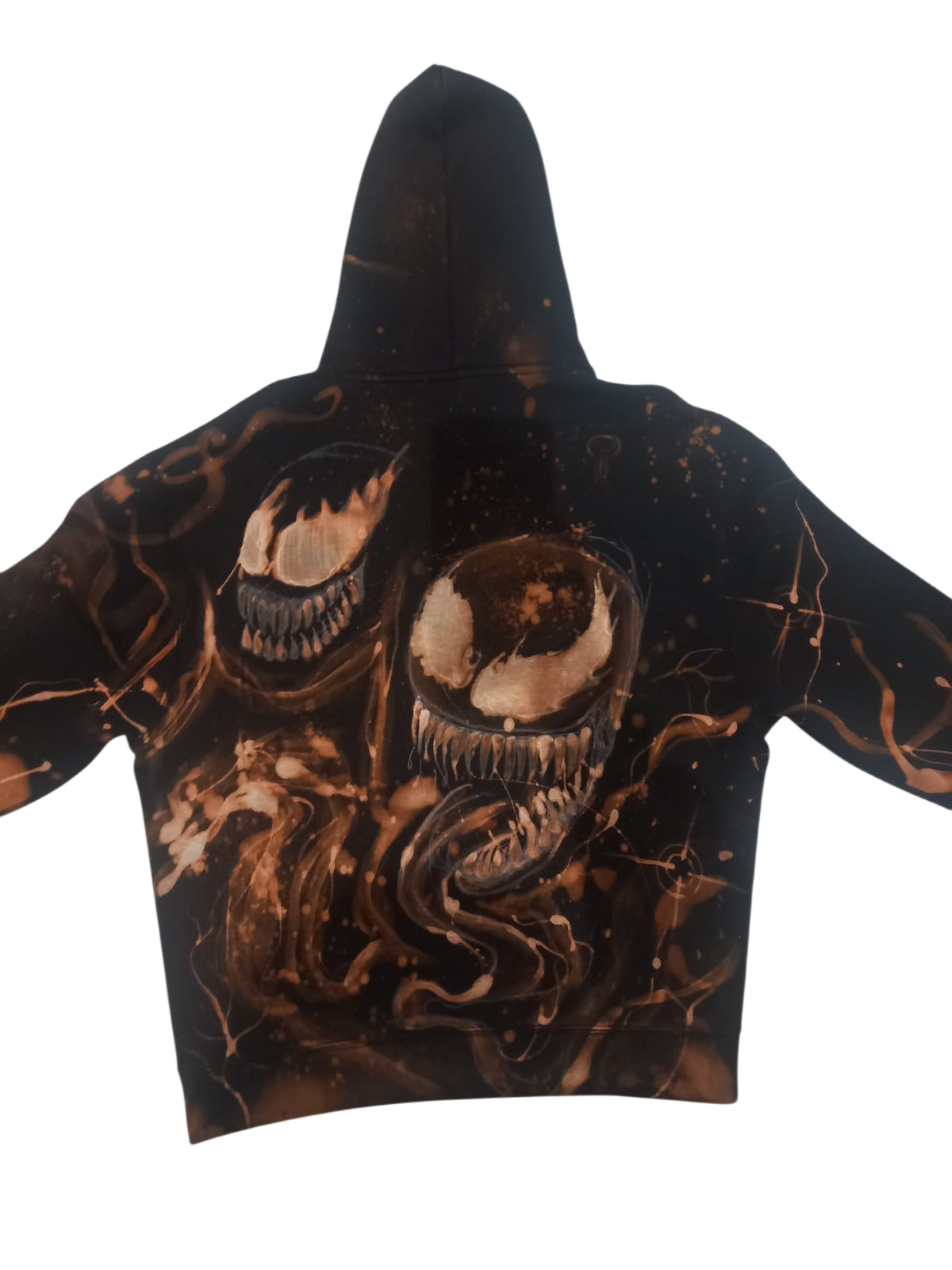 Back of a black hoodie with a detailed hand-painted bleach design