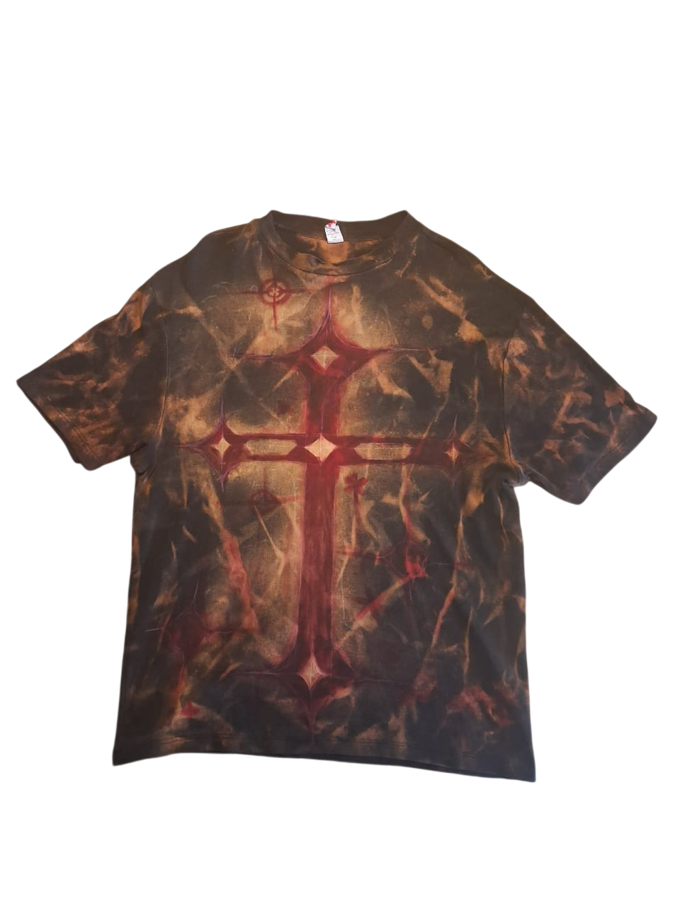 Front of a dark shirt with red and copper hand-painted artwork